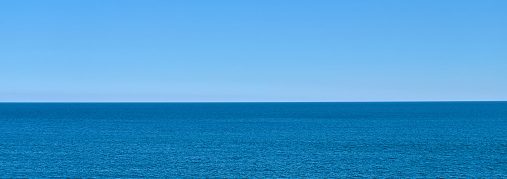 Miles Spencer - Sea ocean skyline horizon. Day light. No sun reflection. Background. Copy space